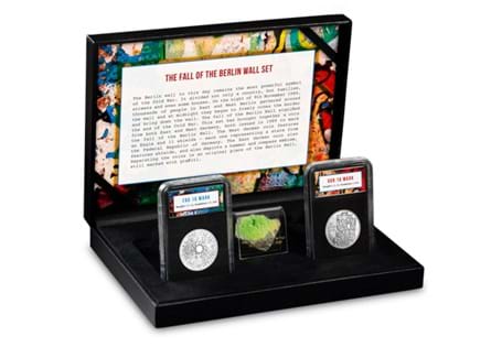 This set includes two 1989 dated silver coins from East and West Germany, minted in the year that the Berlin Wall fell. Also included is an original piece of the Berlin Wall.  