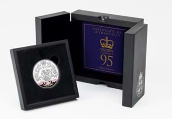 The Queen's 95th Birthday Silver Proof £5 in display box beside certificate