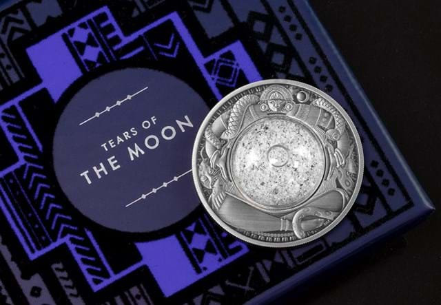 Australia 2021 Tears of the Moon 2oz Silver Antique Coin laid on packaging