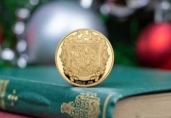Isle of Man 2021 Christmas Gold Sovereign Reverse stood on green book spine