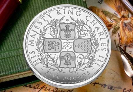This £5 coin has been issued to for the 75th Birthday of King Charles III. The design is inspired by a Charles II crown, which has the design of a standard cruciform shield. Proof finish. EL:  4995.