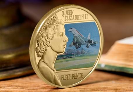 This 24ct Gold-plated Coin features Her Majesty Queen Elizabeth II looking over a full colour illustration of the Supersonic Concorde which had its maiden flight during the Queen's reign in 1969.