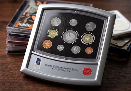 The 2000 Proof set contains the following: Millennium £5, the Welsh £1, £2, 50p (Libraries) 20p, 10p, 5p, 2p and 1p. This set comes presented in a deluxe royal mint silver stand case.